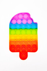 Pop it silicone rainbow anti-stress toy isolated on white background. Simple dimple, popular modern stress relief toys for adults and children. Fidget kid toy, Pop Bubble Fidget.