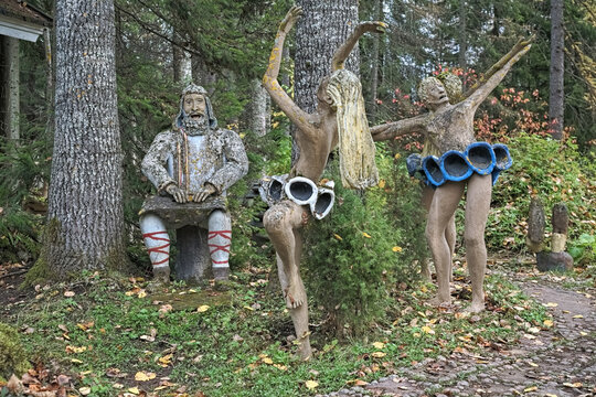 Parikkala, Finland. Sculptures of a poem singer and ballerinas by artist Veijo Ronkkonen in his sculpture park. The park contains about 560 concrete statues and a magnificent garden.