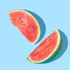 Cut watermelons on blue background