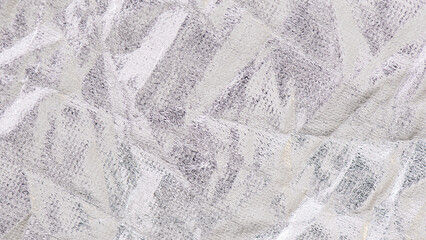 Silver Grunge Texture with scratches and distressed effect. Silver metallic grunge textile texture shith highlights. Crumpled fabric.