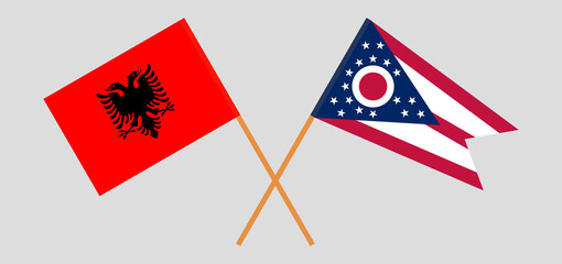 Crossed flags of Albania and the State of Ohio. Official colors. Correct proportion
