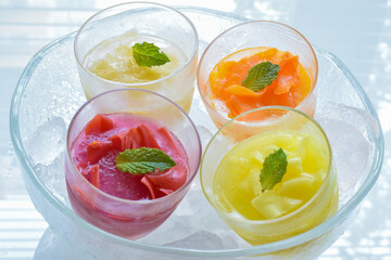 Fototapeta na wymiar Four kind of Fruits Sorbet with ice in the bowl, Summer image