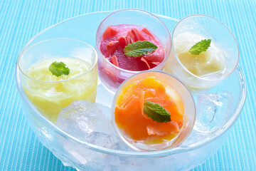 Four kind of Fruits Sorbet with ice in the bowl, Summer image, Blue background