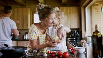 Family with small children cooking in kitchen. - Powered by Adobe