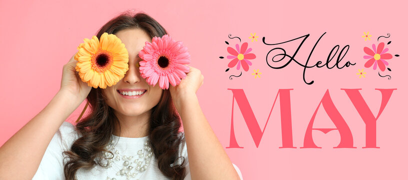 Beautiful young woman with flowers and text HELLO, MAY on pink background