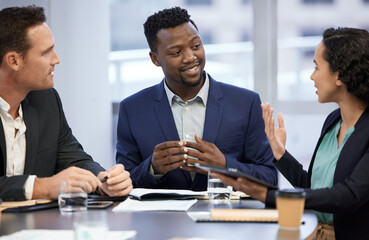 Shes got some ideas. Cropped shot of a group of white collar workers meeting in the boardroom.