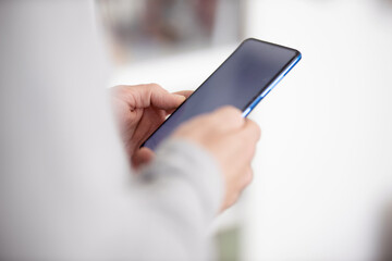 Male hands typing on smartphone