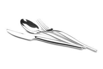 Set of stainless steel cutlery on white background