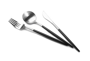 Set of stainless steel cutlery with black handles on white background