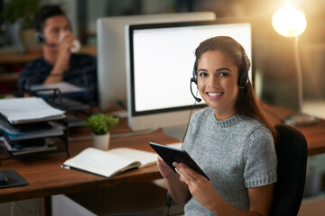 Looking up ways to help the customer even more. Shot of young agents working in a call center.