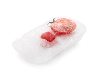 Fresh tomatoes frozen in ice on white background