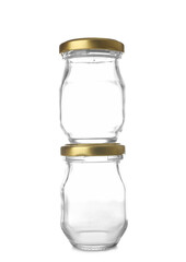 Glass jars with golden caps on white background