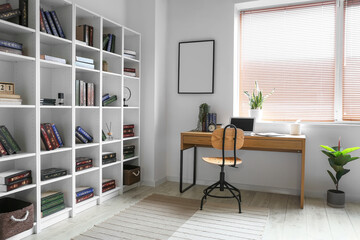 Fototapeta na wymiar Interior of modern home library with workplace