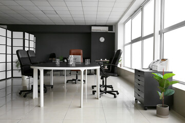 Interior of stylish conference hall with table and chairs