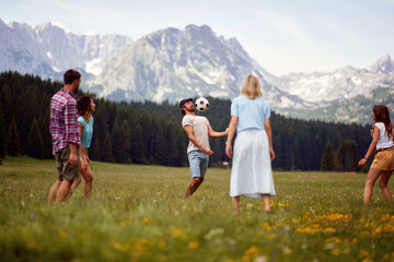 Naklejka premium Happy young people in action with ball. Funny play