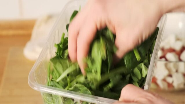 Fresh arugula leaves, top view. Bunch of green fresh arugulaю. The concept of a healthy lifestyle
