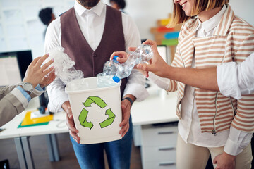 Environmentally focused employees recycling together