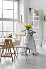 Interior of room prepared for master-class in art on Easter eve