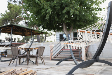 Interior of summer cafe and a hammock