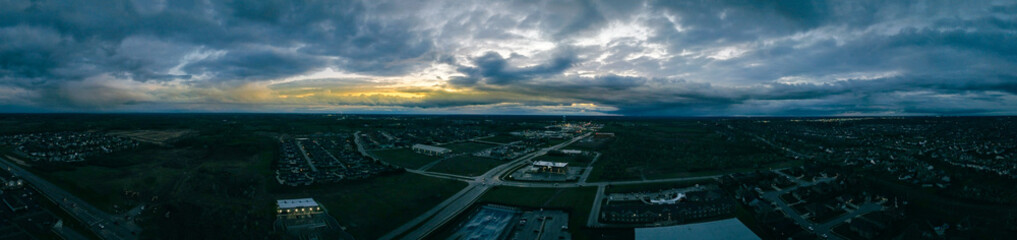 Aerial panorama of the district around Brannon crossing shopping district between cities of Lexington and Nicholasville, Kentucky during late evening dramatic cloudscape