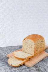 Wheat bread loaf on a white background.	
