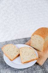 Wheat bread loaf on a white background.	
