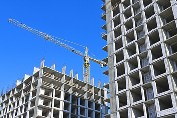 Crane and highrise construction site