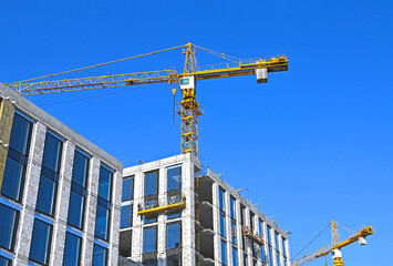 Crane and highrise construction site