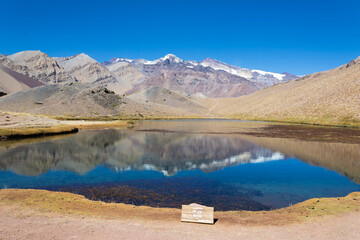 Duck lake trekking destination near Cajon del Maipo, Chile. Sign translates to: 'Duck's lake, 3180 m.a.s.l.' - obrazy, fototapety, plakaty