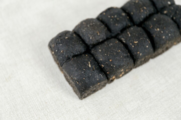 Black Japanese Milk Bread on a white background. Food Baking concept Fresh baked organic homemade soft milk loaf bread.	
