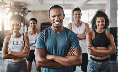 Were here for the fitness. Portrait of a group of confident young people working out together in a gym.