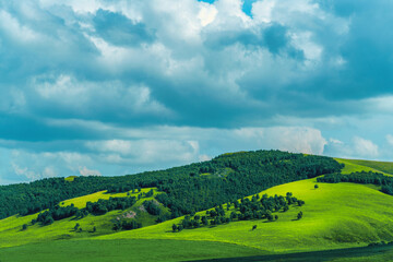 Hills, grasslands and blue sky