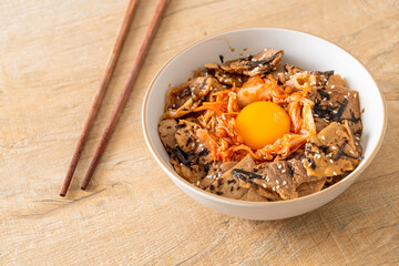 pork bulgogi rice bowl with kimchi and Korean pickled egg