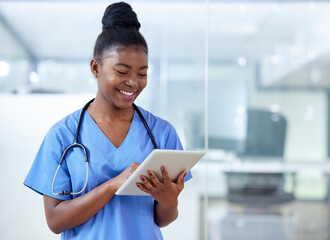 Theres nothing my tablet doesnt help me with. Shot of a young female doctor using a digital tablet at work. - Powered by Adobe