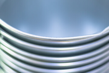 Metal buckets nested in each other.