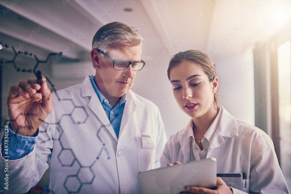 Aufkleber it all starts with an equation. shot of two focused scientists working together solving equations on