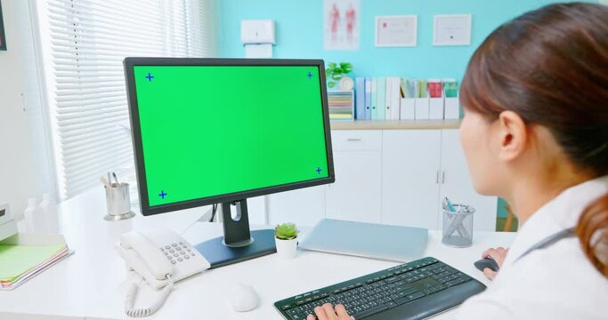 female doctor use computer