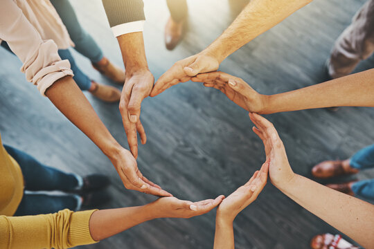 Were All In It To Make A Success. High Angle Shot Of A Group Of Unidentifiable Businesspeople Forming A Circle With Their Hands.