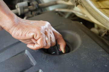 Open the engine cover to change the engine oil.