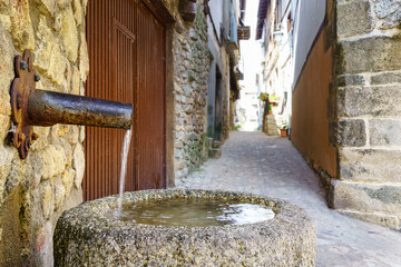 Fresh water fountain in the old medieval village of Salamanca, Spain.