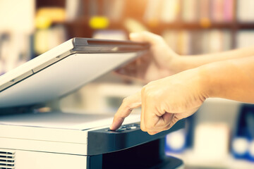 Copier printer, Close up hand office man press copy button on panel to using the copier or photocopier machine for scanning document printing a sheet paper and xerox photocopy.