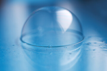 soap bubble close up. abstract blue water background