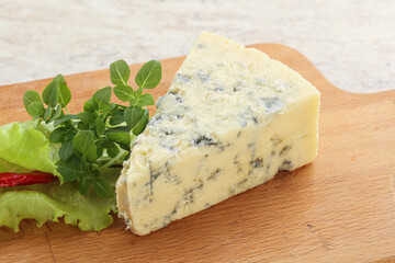Blue cheese piece over board