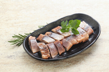 Delicous sliced herring fillet in grape sauce