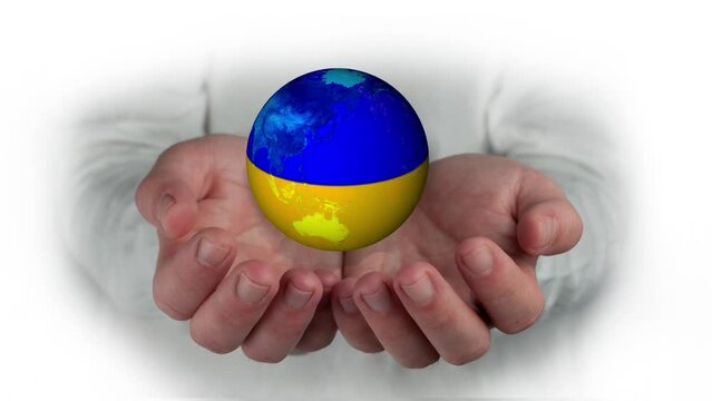 
united hands protecting the world ball painted with the flag of ukraine to maintain the union and resolve the conflict