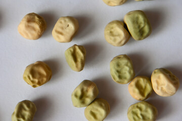 Dry green peas on white background, close up