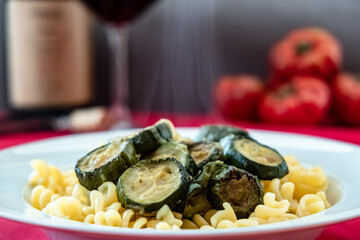 Italian food: pasta with zucchini and parmesan