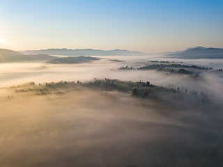 Morning fog in the Ukrainian Carpathians. Aerial drone view.