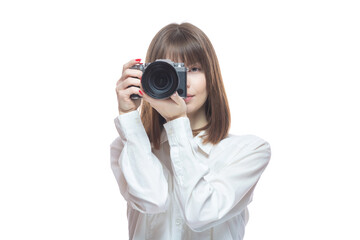 Portrait of a young woman in a white shirt taking pictures with a camera. The concept of a successful photographer, wedding photographer, photo for documents. Isolated on white background.