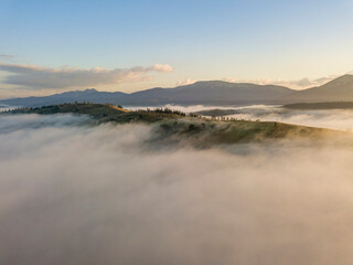 Morning fog in the Ukrainian Carpathians. Aerial drone view.